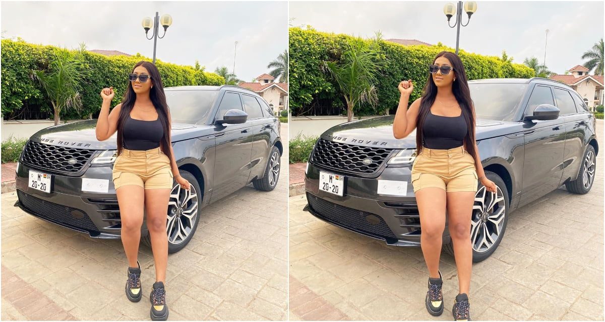 Hajia4real poses infront of her customize Range Rover gift as she throw shots at critics (photo)
