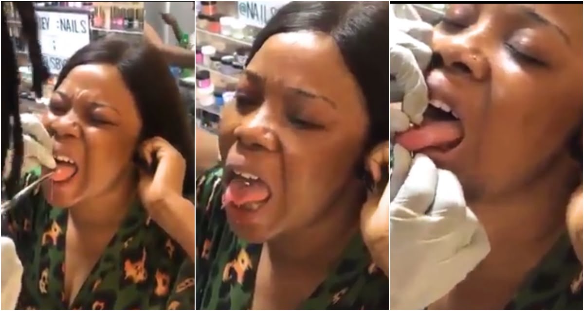 Watch The Pain Ladies Goes Through During Tongue Piercing - Video