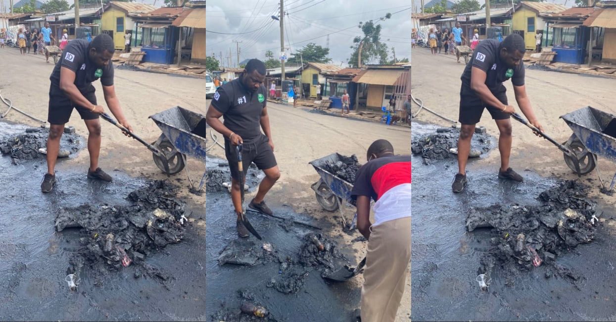 John Dumelo helps clean chucked gutters in his constituency
