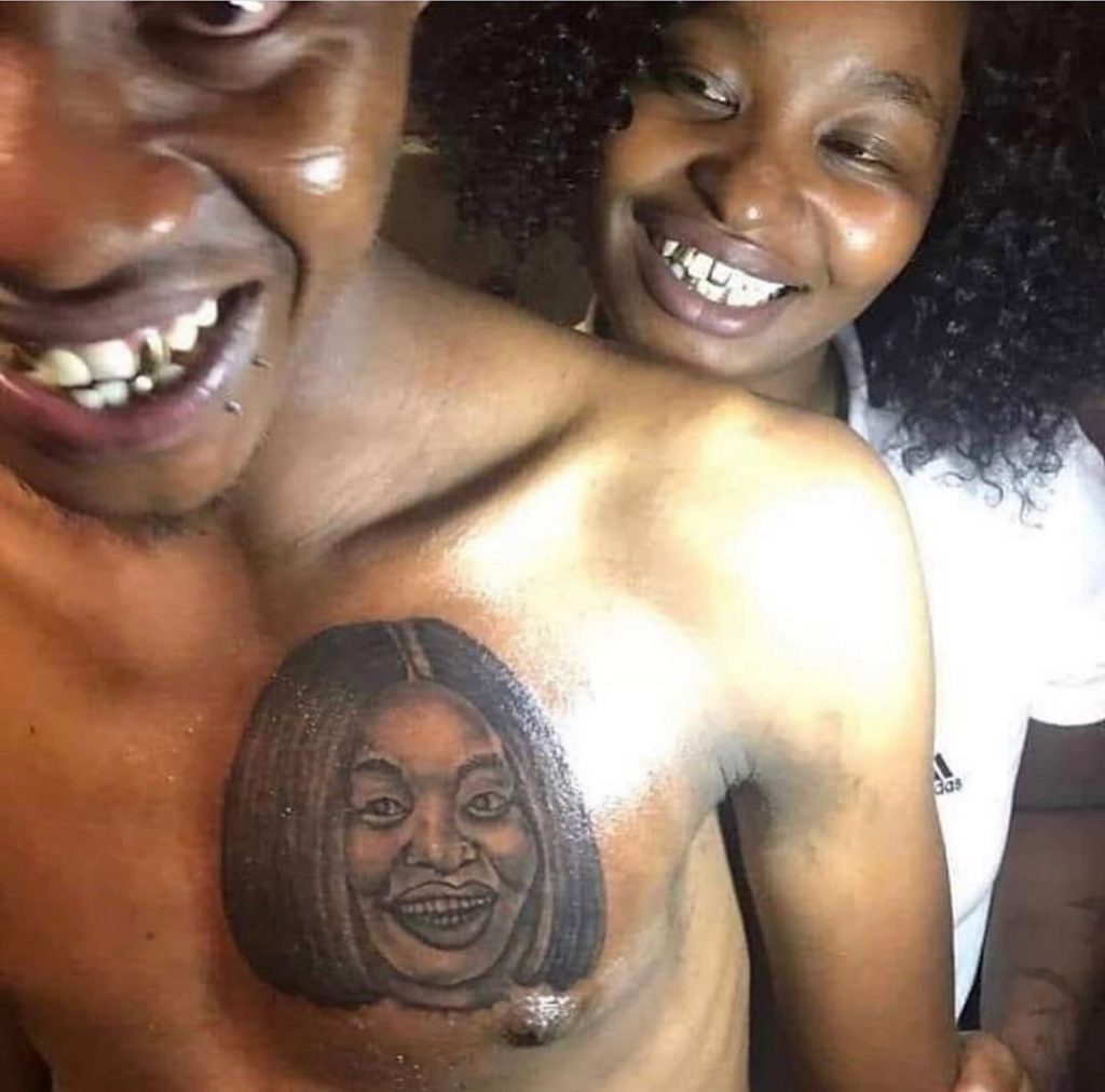 guy tattoos girlfriend's face on his chest