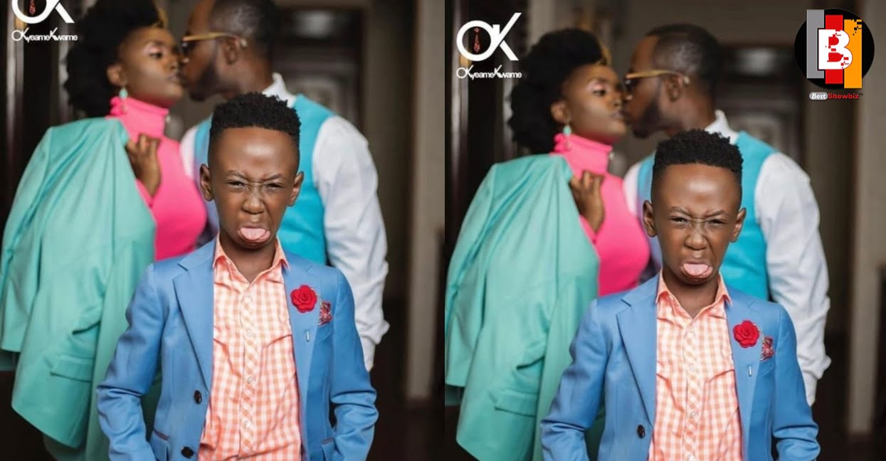 Okyeame Kwame and wife passionately kissing in front of their son in new photos