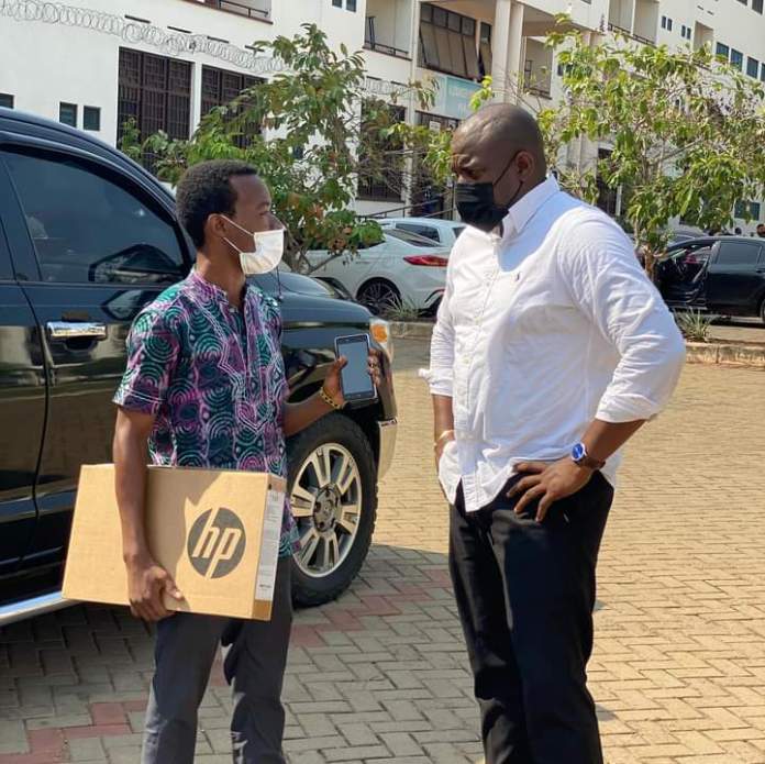 John Dumelo continues sharing laptops for Tertiary students even though he lost the Elections (photos)