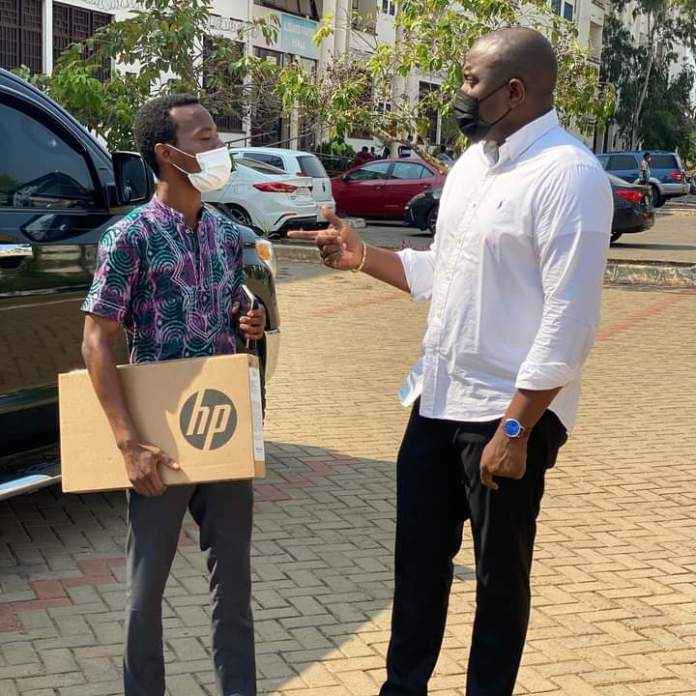 John Dumelo continues sharing laptops for Tertiary students even though he lost the Elections (photos)