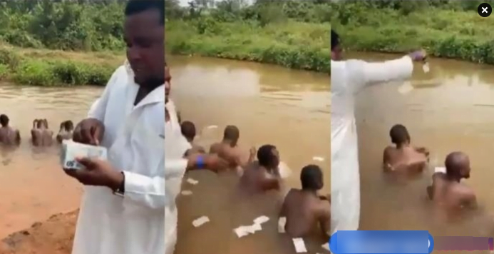 Video of a Mallam bathing Sakawa boys in a river surfaces