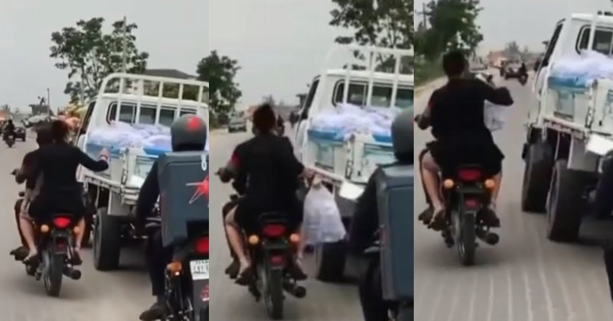 Two men on a Motorbike steal a bag of "pure water" from a moving vehicle (Video)