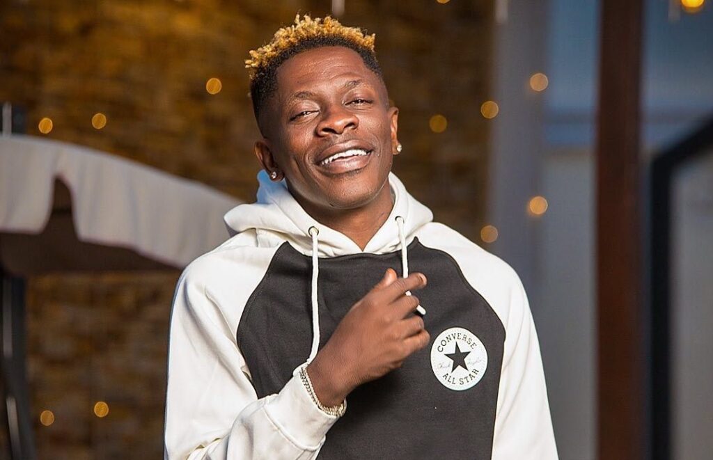 New photos of Shatta Wale receiving prayers from Duncan Williams pops up