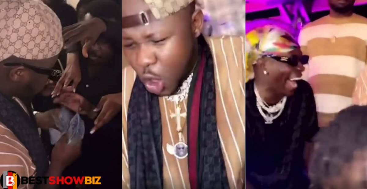 Video; Medikal and Shatta Wale challenges themselves as the spray money at a part