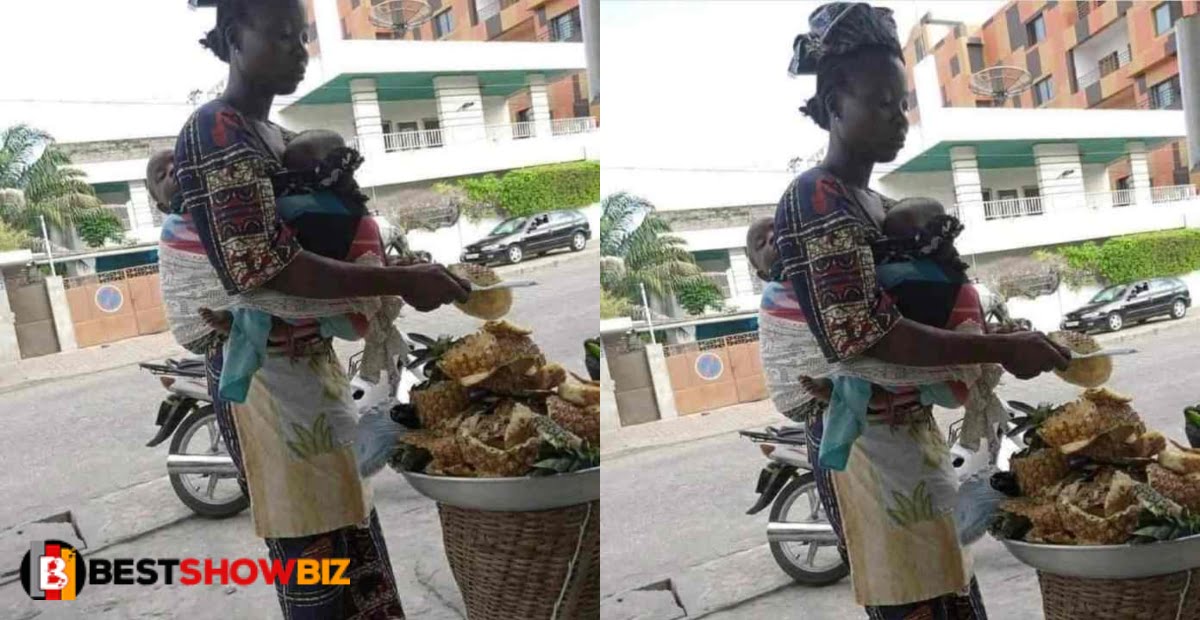 Life is not easy, Mother with two babies at her back spotted hawking pineapples (photo)