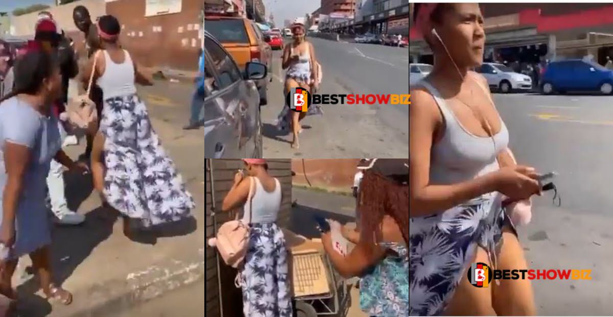 Women harasses beautiful lady in public for wearing indecent clothes (video)