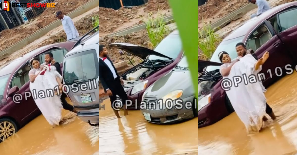 Yawa as newly-weds gets stuck in muddy road after their wedding car broke down (video)