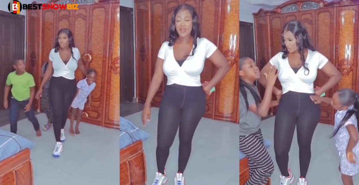 She has four kids but still has flat tummy - Mercy Johnson's kids all over her in new video