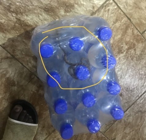 a man was nearly bitten by a snake after discovering a snake inside a bottle water pack he had bought (photos)