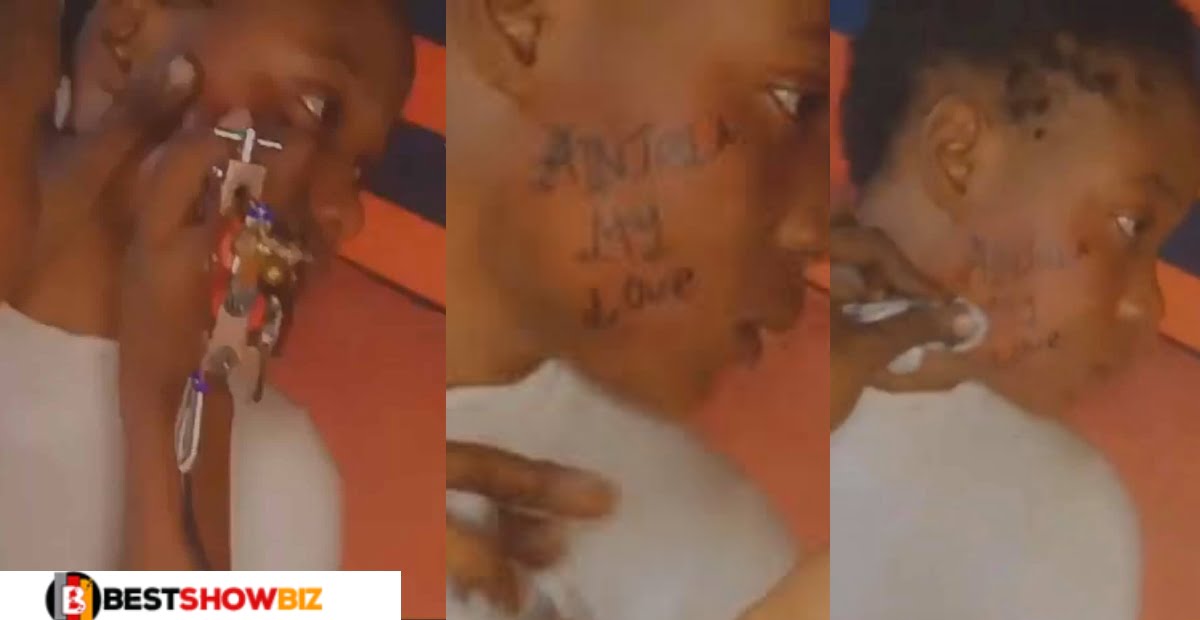 True love or m@dness? Lady tattoos boyfriend’s name on her face - (Video)