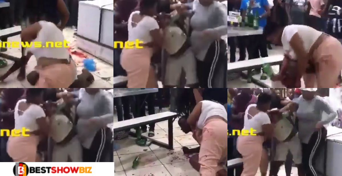 Video: Wife beats her Husband at a club after catching Him with another Lady