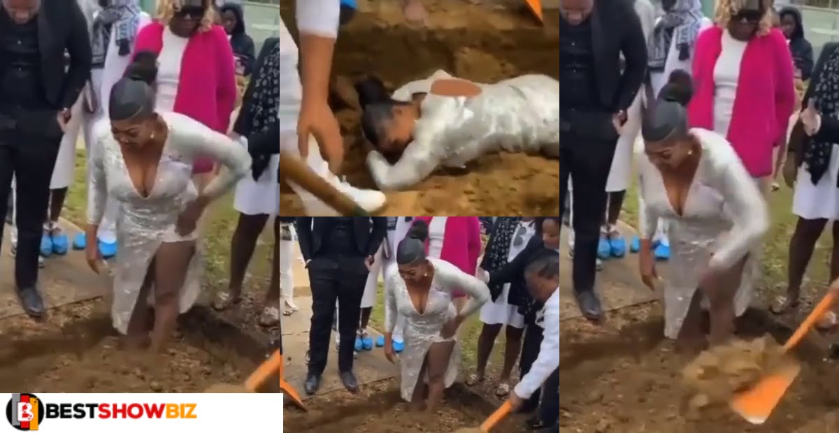 Watch the heartbreaking moment a mother refused to leave the grave of her child