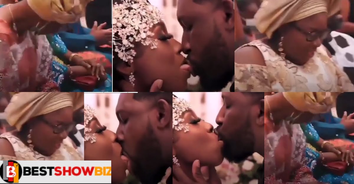 Video: Bride’s Parents Closes Their Eyes While Watching Their Son-In-Law “Chew” Their Daughter’s Lips