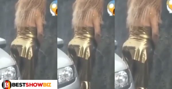 Slay queen looks around nervously after she was spotted peeing in public like a man (video)