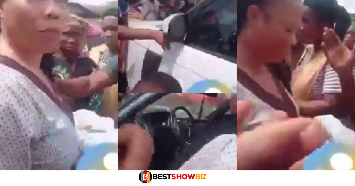 Accra: Rich woman almost beaten by mob after she parked her Range Rover and started sharing strange meat to children (Video)