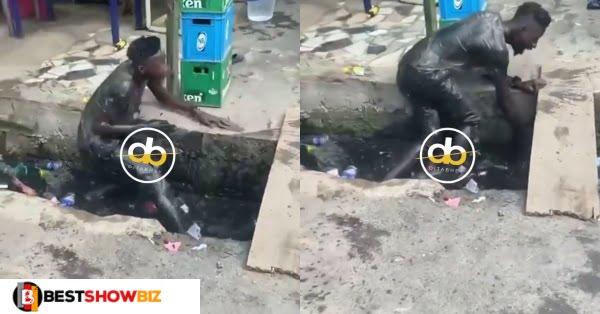 Man baths himself in a dirty gutter after taking too much weed (video)
