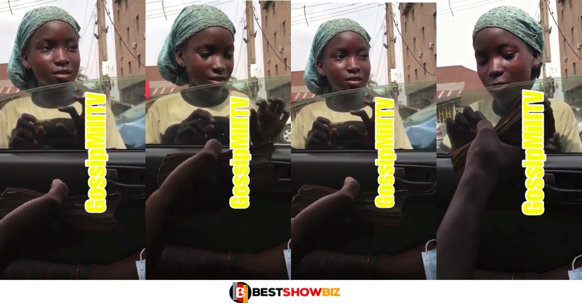 Child street beggar rejects a bundle of money a man was giving her, she was afraid (Watch video)