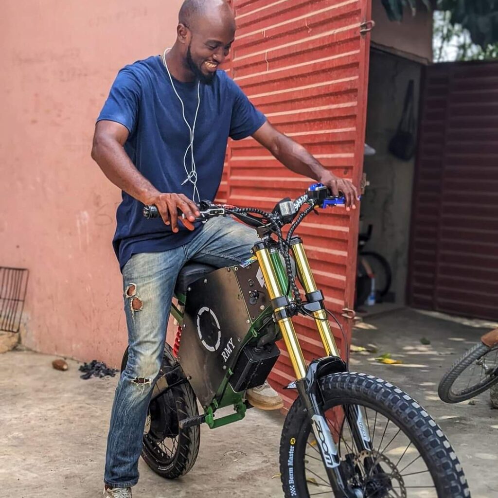 A Ghanaian man invents an electric bicycle that can charge phones and other electronic devices. (video + photos)