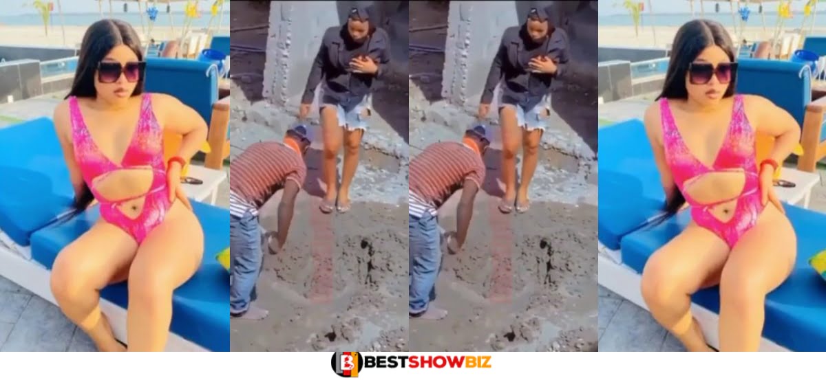 Moment Popular Accra ‘slay queen’ run from camera after being spotted carrying Mortar for a living (Video)