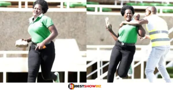 Lady storms football pitch with stone after her boyfriend was injured during a match.