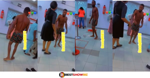 Man causes commotion at the Bank, stripping nak3d and asking for a refund after his money was debited (video)