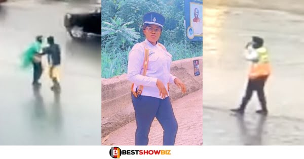 A beautiful policewoman spotted in heavy rain directing Traffic to avoid accidents.