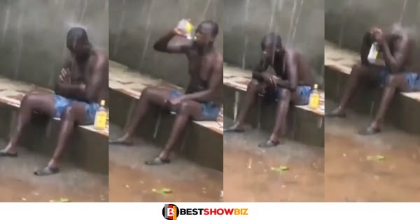 Video of a 'Frustrated' man sitting in the rain and drinking a bottle of gin stirs online