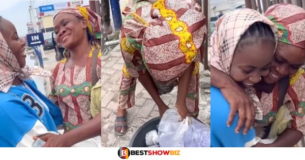 Young Lady Buys All The Goods Of A Woman Hawking Under Rain with Her Kids - Watch Video