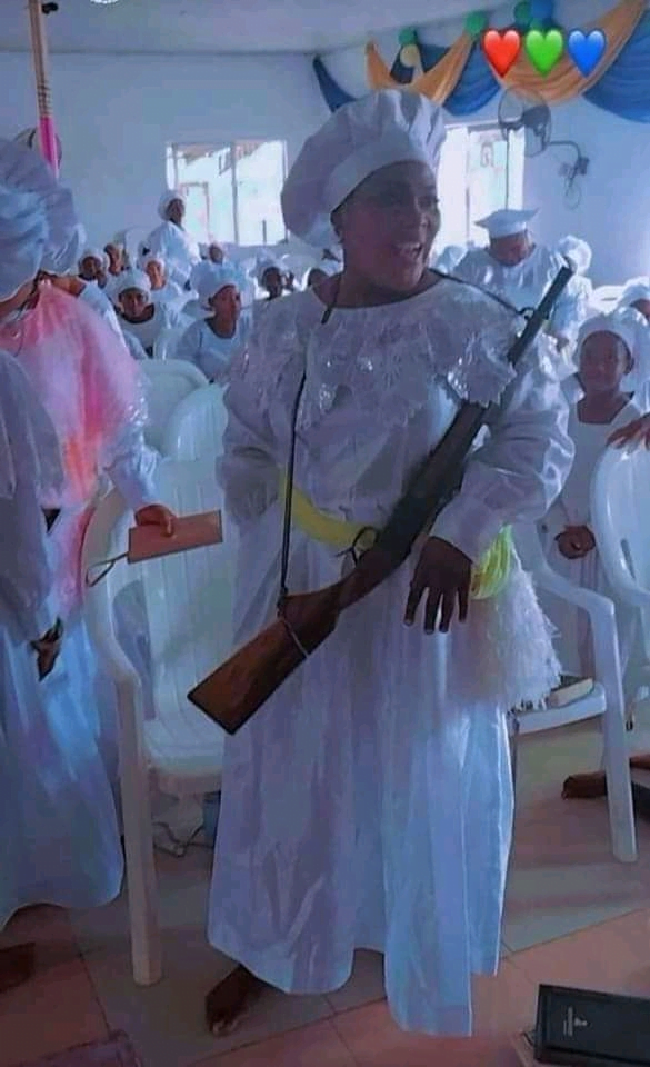 Woman spotted carrying a gun in church to protect herself after terrorist k!lled Christians in Nigeria