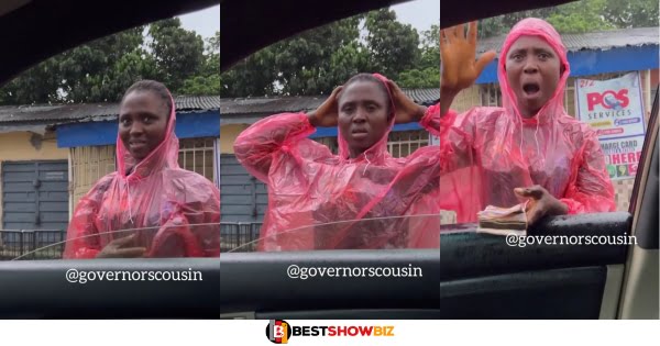 lady cries and roll on the floor after a good samaritan buys everything she was selling in heavy rain. (video)