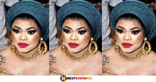 Reactions As Bobrisky Spotted With Hair On His Chest While Dressed As A Woman At A Wedding