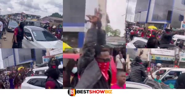 Watch Video As Fake Shatta Wale causes traffic in Town with his Benz and Bodyguards