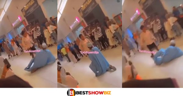 Man falls down flat after his girlfriend gave him a heavy slap for proposing to her in public (video)