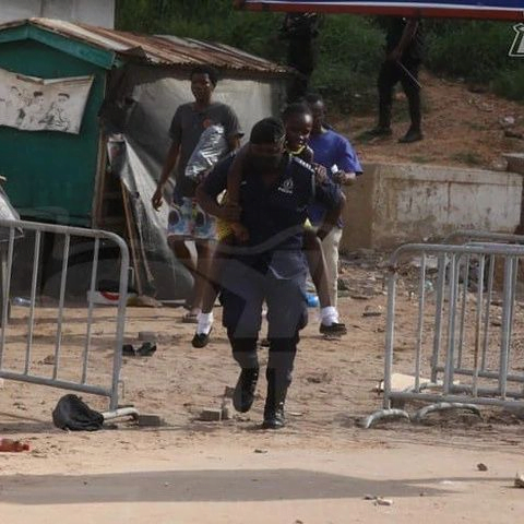 Police Officers Captured Protecting School Children During Their Clash With Protesters (Photos)