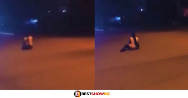 Lady sleeps in the middle of a road waiting for a car to finish her after her boyfriend broke up with her (watch video)