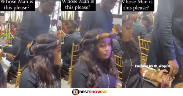 Married man caught on camera using a smart Technique to give his number to another lady at a party (watch video)
