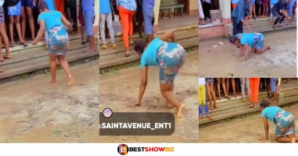 Lady cries and rolls in the dirt like a child after completing Nursing training