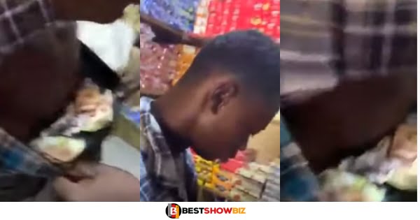 Shop attendant caught stealing 7900 cedis and putting it in his boxers. Boss shocked because he pays him well (watch video)