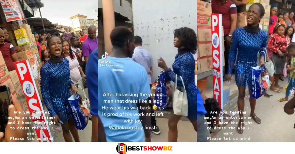 Do you feed me? – Crossdresser says as market men disgraces him for dressing like a lady (video)
