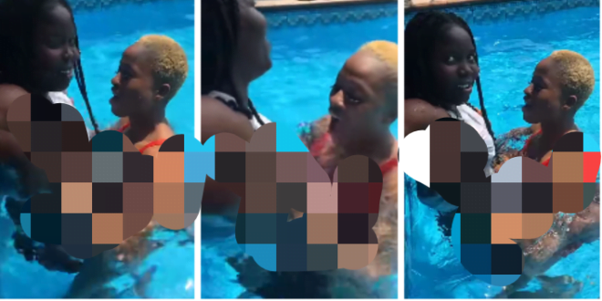 Lady plays with the b()()bs of her friend in a pool (watch video)
