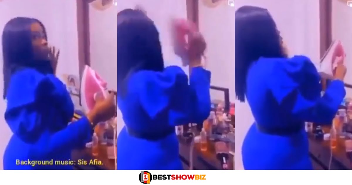 Daughters of Eve; Netizens react to a video of a Lady ironing her hair with an electric iron (watch video)