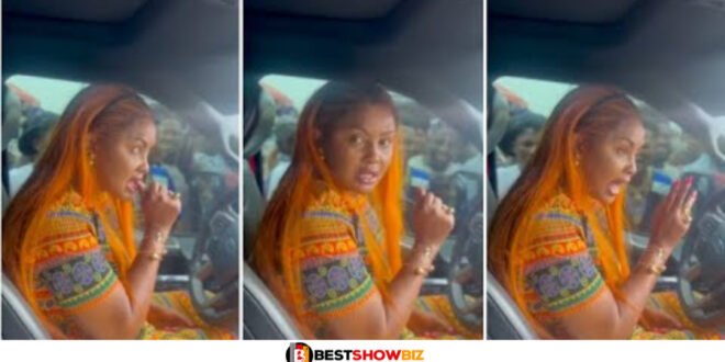 Video of Nana Ama Mcbrown driving away as her fans beg her for money causes stir online (watch)