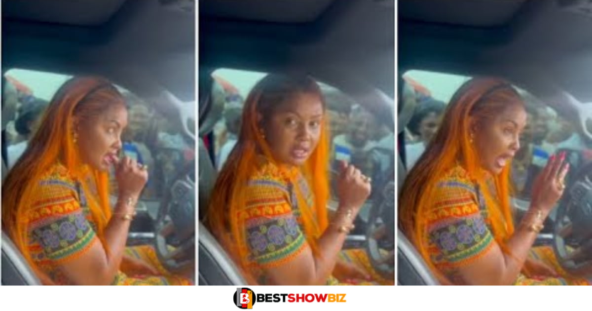 Video of Nana Ama Mcbrown driving away as her fans beg her for money causes stir online (watch)