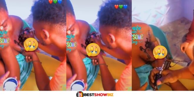 Slay queen cries like a baby while getting a tattoo on her b()()bs (watch video)