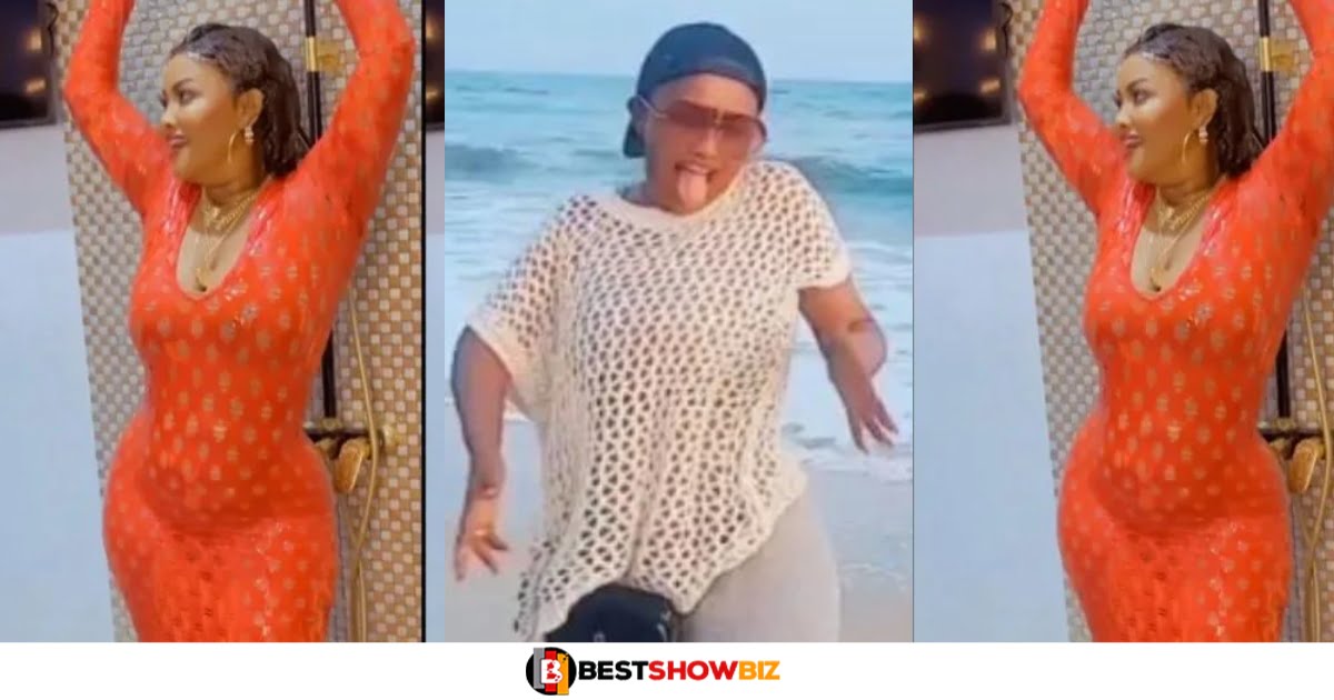Nana Ama Mcbrown intentionally raises her shirt to show her flat tummy to fans (watch video)