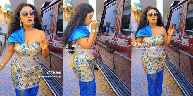 Nana Ama Mcbrown teases haters as she rocks in a beautiful dress and flaunts her expensive G-Wagon in new video