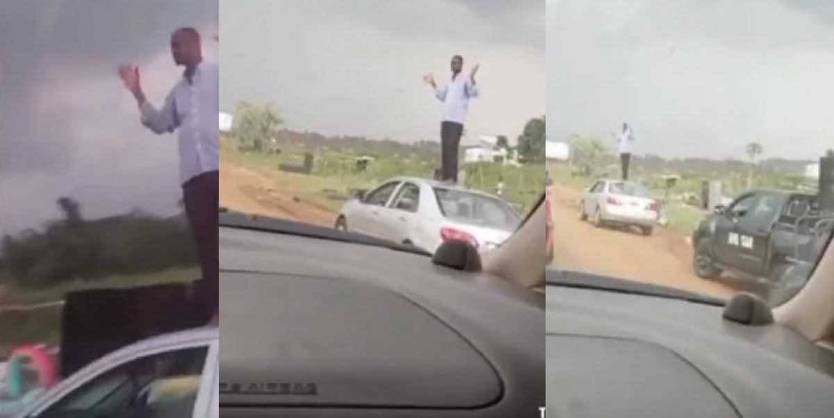 Soldiers punish a man by making him stand on his car to wave at moving cars - Video